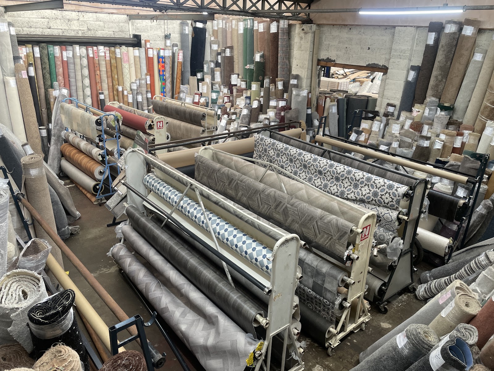 Carpet rolls on the cutting racks